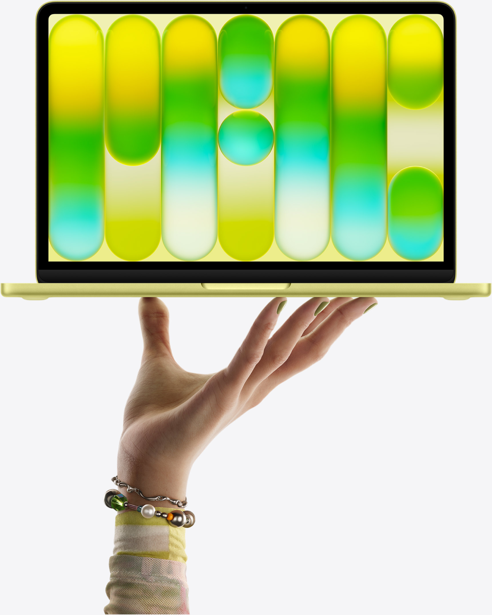 The MacBook Neo Citrus — effortlessly light at 2.7 lbs, and completely fanless. No noise, ever.