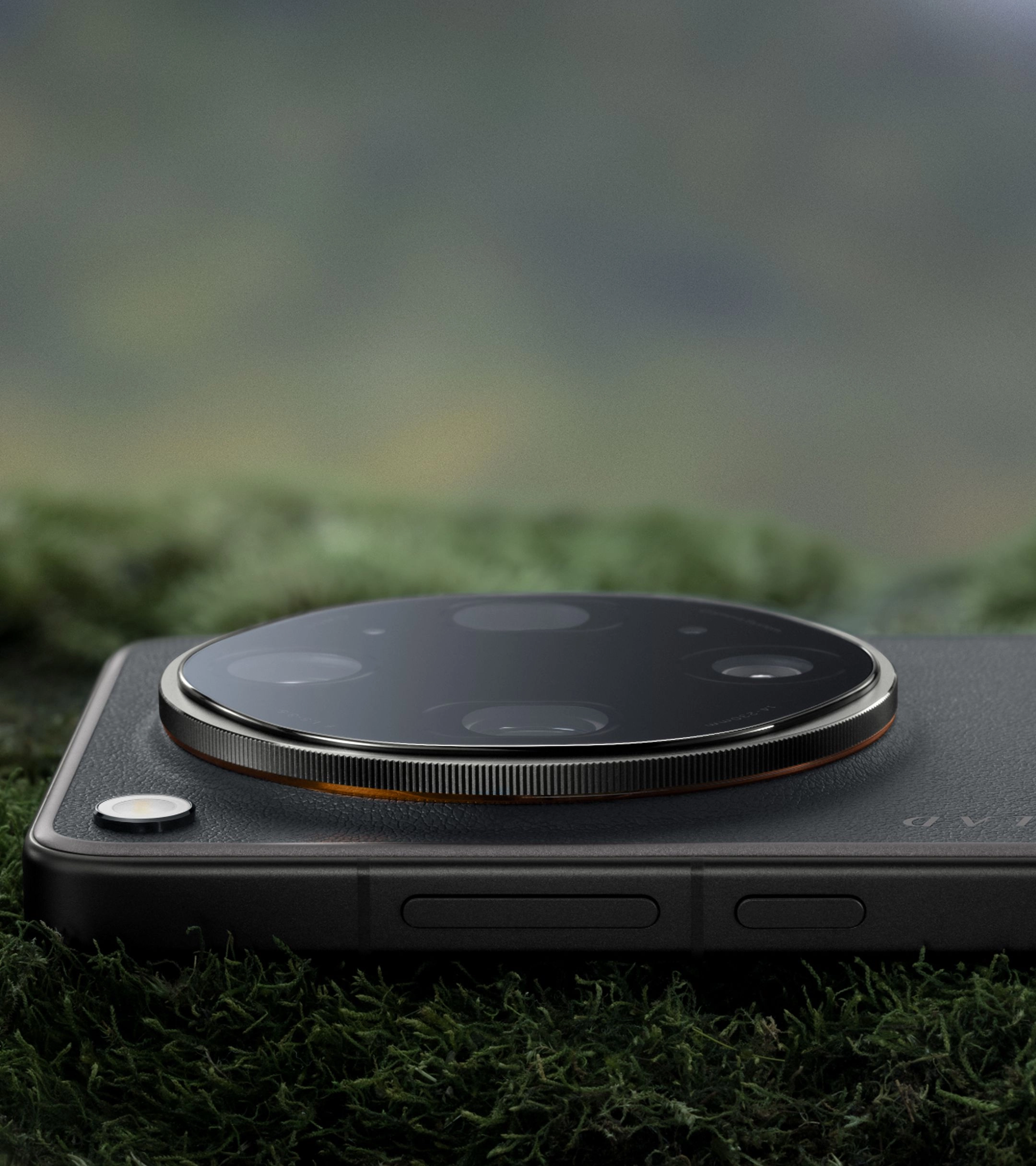 The Find X9 Ultra in Tundra Umber — faux leather back, knurled silver ring, and the orange accent that echoes Hasselblad's X2D shutter button.